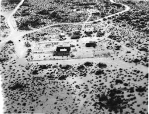 Historical photograph of Casa Grande Ruins National Monument during early 1900s archaeological excavations